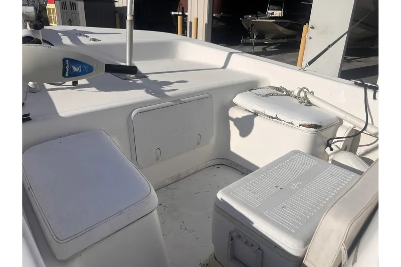 Slide: The Image of 2008 Sundance B18CC boat interior with storage compartments and seating. - 12