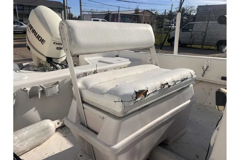 Slide: The Image of Worn-out seat on a 2008 Sundance B18CC boat with Evinrude outboard motor. - 9