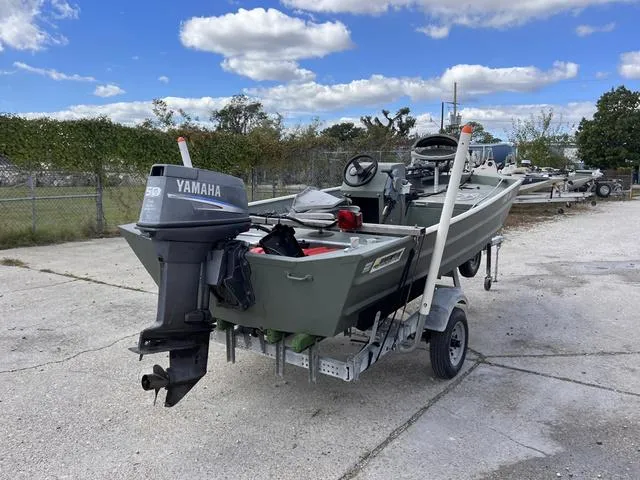 Slide: The Image of 2020 Southfork 1552 boat with Yamaha outboard motor on a trailer. - 12