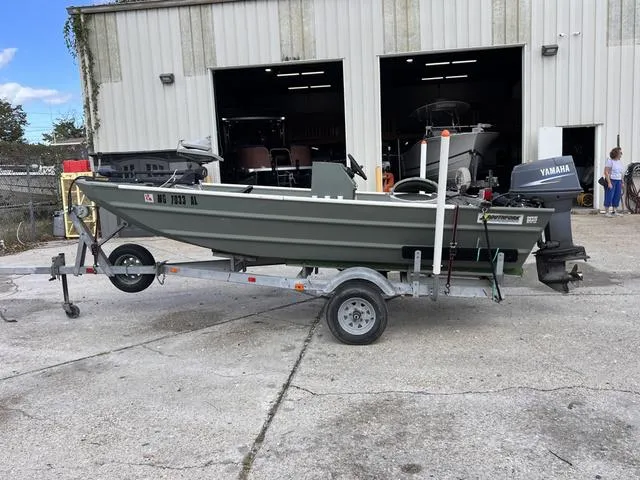 Slide: The Image of 2020 Southfork 1552 boat on trailer outside a garage with Yamaha outboard motor. - 3