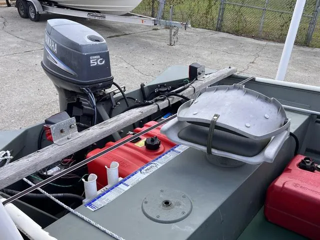 Slide: The Image of Southfork 1552 boat with Yamaha 50 outboard motor, 2020 model, docked with equipment. - 6