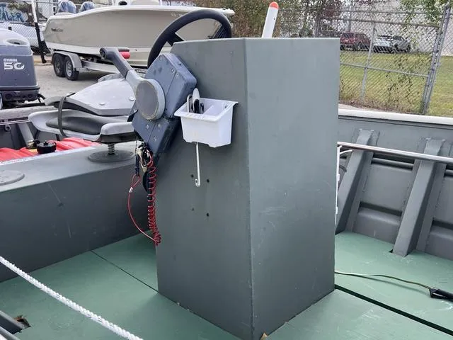 Slide: The Image of 2020 Southfork 1552 boat console with steering wheel and controls. - 8