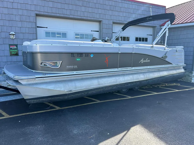 Slide: The Image of 2014 Avalon 2285 Catalina Cruise Twin Toon pontoon boat parked outside. - 1