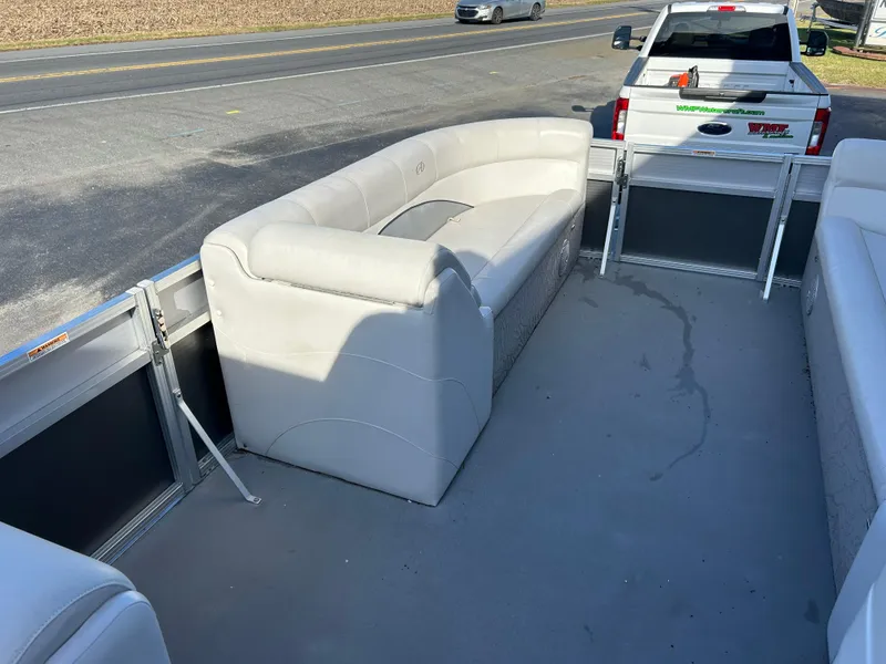 Slide: The Image of 2014 Avalon 2285 Catalina Cruise Twin Toon interior with white seating. - 12