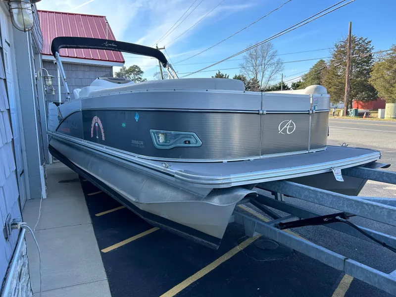 Slide: The Image of 2014 Avalon 2285 Catalina Cruise Twin Toon pontoon boat on trailer. - 2