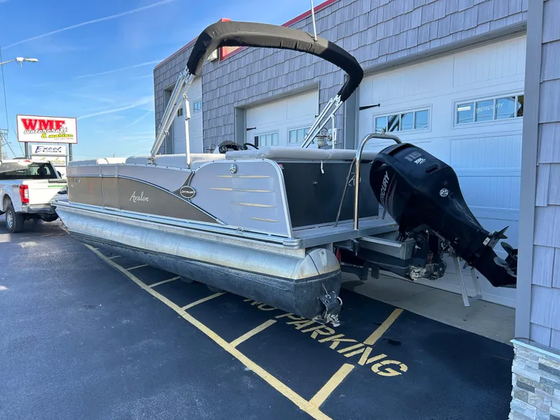 Slide: The Image of 2014 Avalon 2285 Catalina Cruise Twin Toon pontoon boat parked outside. - 5