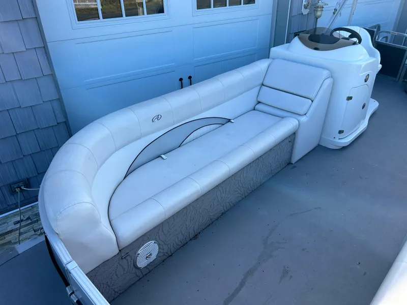 Slide: The Image of 2014 Avalon 2285 Catalina Cruise Twin Toon boat interior with white seating. - 6