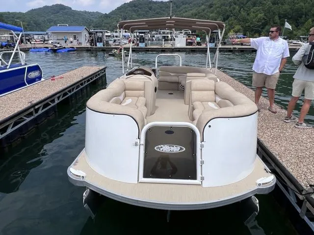 Slide: The Image of 2024 Aloha 230 Club Series pontoon boat docked at a marina with scenic mountain backdrop. - 4