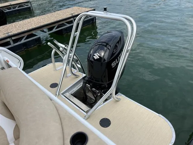 Slide: The Image of 2024 Aloha 230 Club Series boat with outboard motor at dockside. - 7