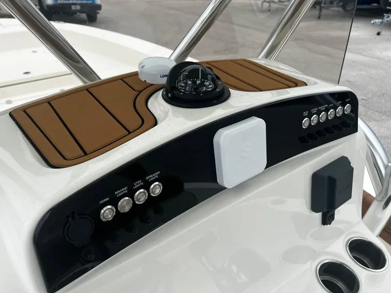Slide: The Image of 2024 Pioneer 220 Bay Sport dashboard with compass and control panel. - 29