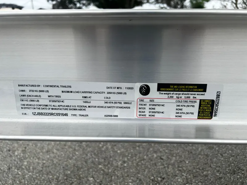 Slide: The Image of Label on 2024 Pioneer 220 Bay Sport trailer detailing specifications and load capacity. - 35