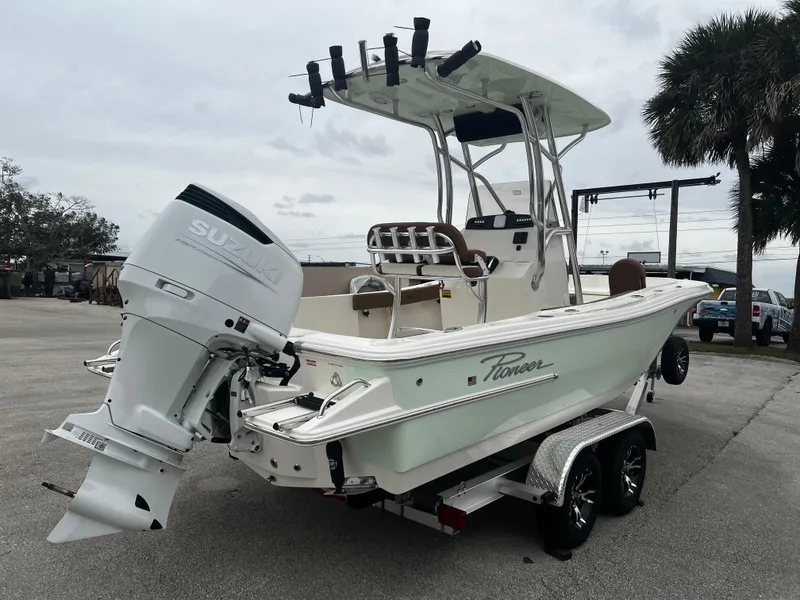 Slide: The Image of 2024 Pioneer 220 Bay Sport boat with Suzuki outboard motor on trailer. - 6