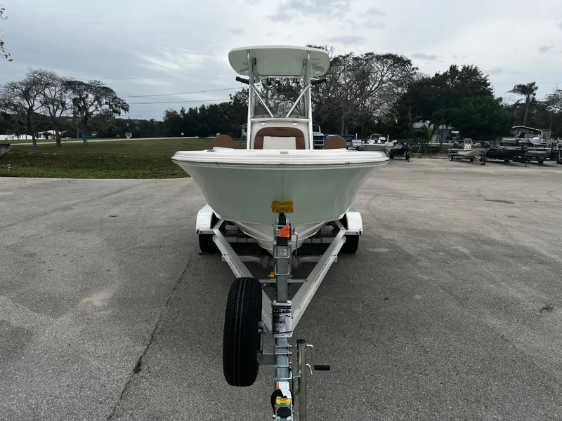 Slide: The Image of 2024 Pioneer 220 Bay Sport boat on trailer in parking lot. - 9