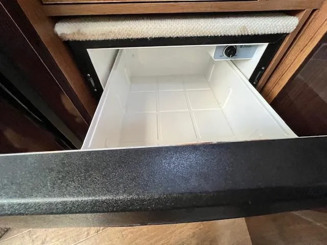 Slide: The Image of Open drawer in 2017 Sea Ray 330 Sundancer boat interior, showcasing storage space. - 22