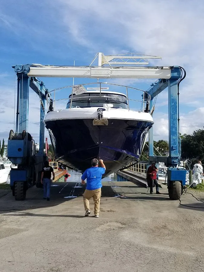 Slide: The Image of 2005 Sea Ray 500 Sundancer yacht in dry dock, undergoing maintenance. - 10