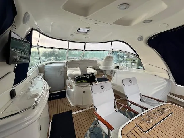 Slide: The Image of Luxurious interior of 2005 Sea Ray 500 Sundancer yacht with elegant seating and modern amenities. - 15