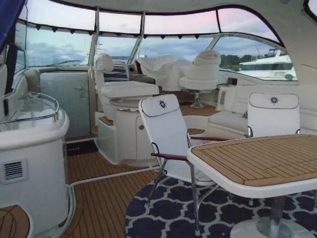 Slide: The Image of Luxurious 2005 Sea Ray 500 Sundancer yacht interior with elegant seating and wooden table. - 19