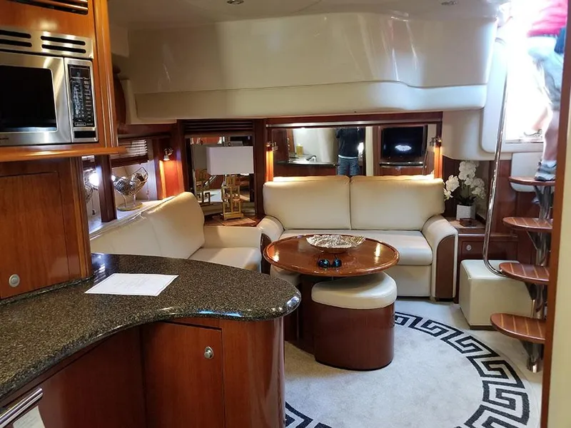 Slide: The Image of Luxurious interior of 2005 Sea Ray 500 Sundancer yacht with elegant seating and modern amenities. - 26
