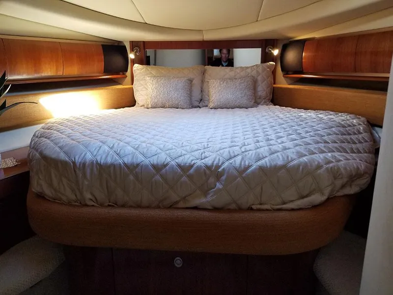 Slide: The Image of Luxurious bedroom interior of 2005 Sea Ray 500 Sundancer yacht with elegant bedding. - 27