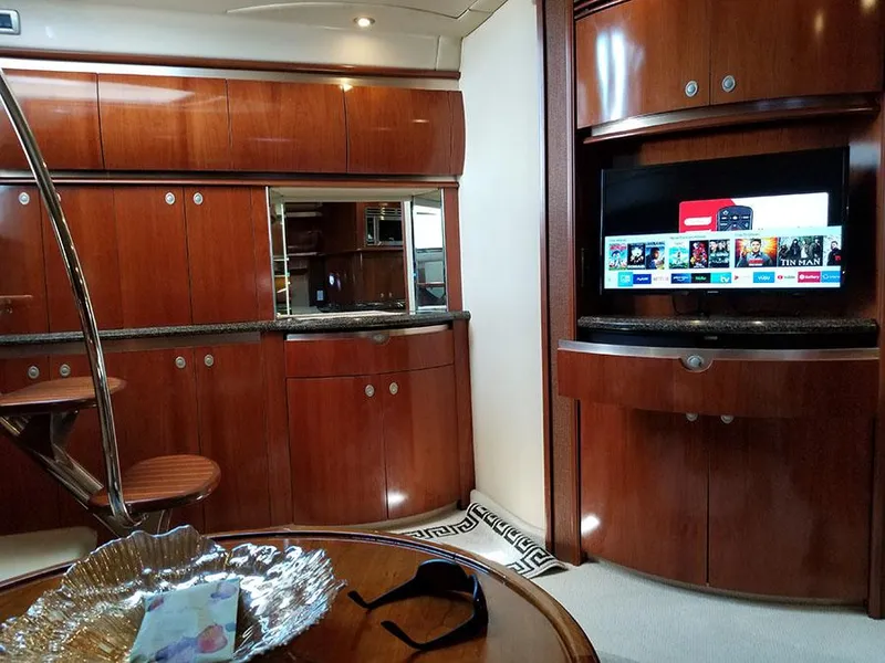 Slide: The Image of Luxurious interior of 2005 Sea Ray 500 Sundancer yacht with wood cabinetry and modern amenities. - 29