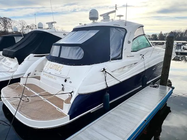 Slide: The Image of 2005 Sea Ray 500 Sundancer yacht docked at marina, featuring sleek design and modern amenities. - 3