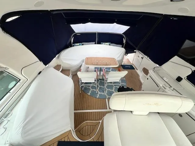 Slide: The Image of Luxurious 2005 Sea Ray 500 Sundancer yacht interior with elegant seating and dining area. - 39