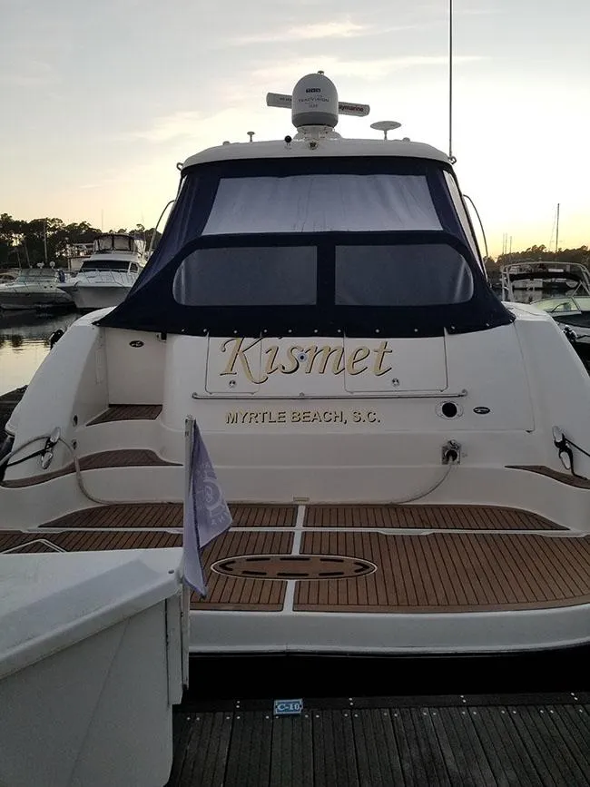 Slide: The Image of 2005 Sea Ray 500 Sundancer yacht docked at marina, rear view. - 4