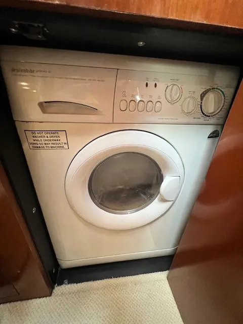 Slide: The Image of Compact washing machine inside a 2005 Sea Ray 500 Sundancer yacht. - 48