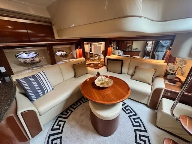 Slide: The Image of Luxurious interior of a 2005 Sea Ray 500 Sundancer yacht with elegant seating and decor. - 49