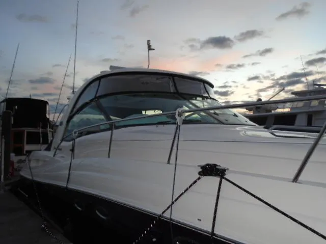 Slide: The Image of 2005 Sea Ray 500 Sundancer yacht docked at sunset, showcasing sleek design and luxury features. - 6