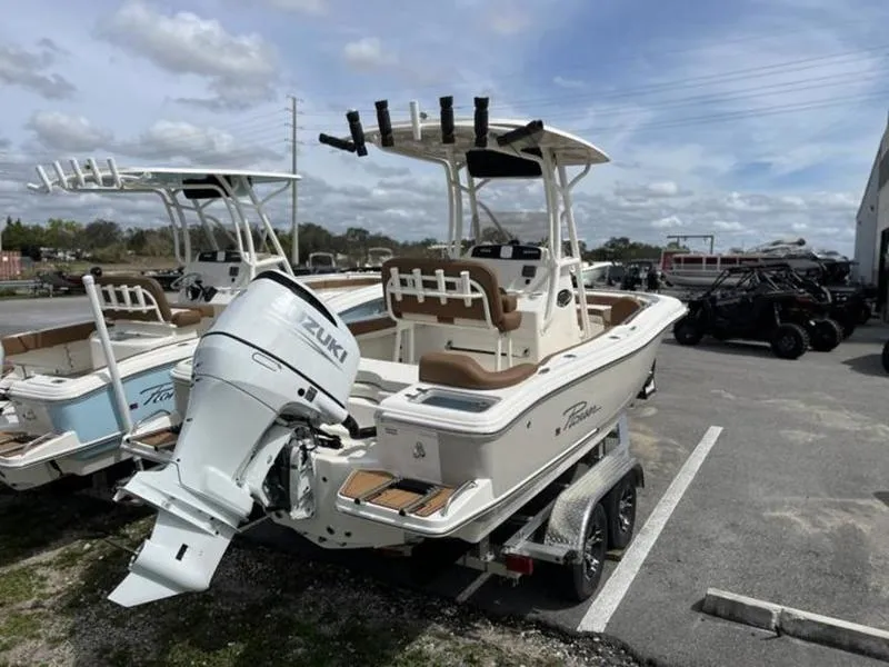 Slide: The Image of 2024 Pioneer Islander 222 boat with Suzuki outboard motor on trailer. - 14
