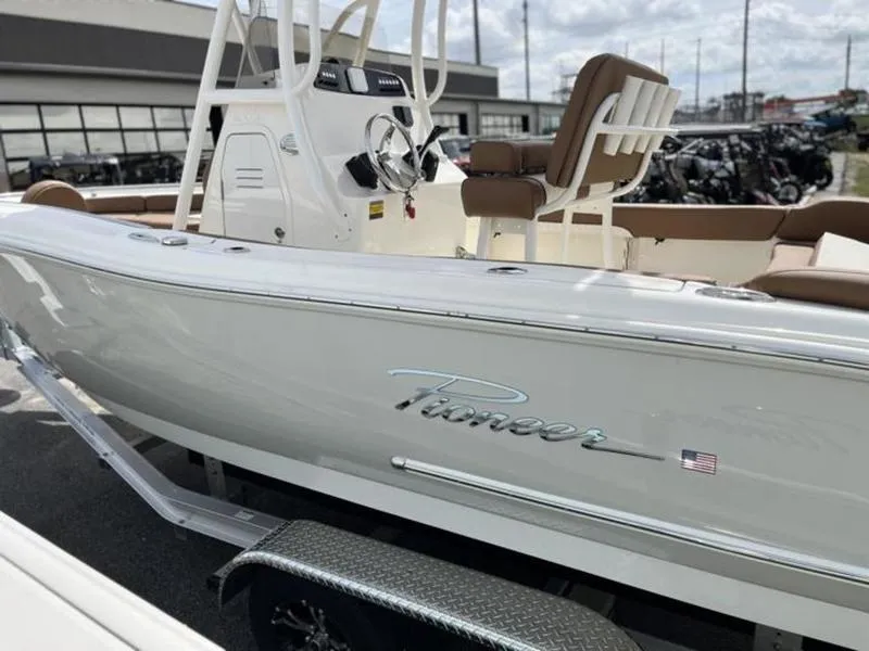 Slide: The Image of 2024 Pioneer Islander 222 boat on trailer, showcasing sleek design and modern features. - 17