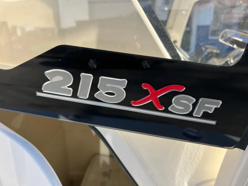 Slide: The Image of 2024 Scout 215 XSF boat logo on black panel. - 12