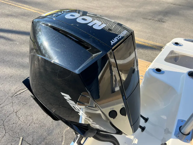 Slide: The Image of 2024 Scout 215 XSF boat with Mercury outboard motor. - 13