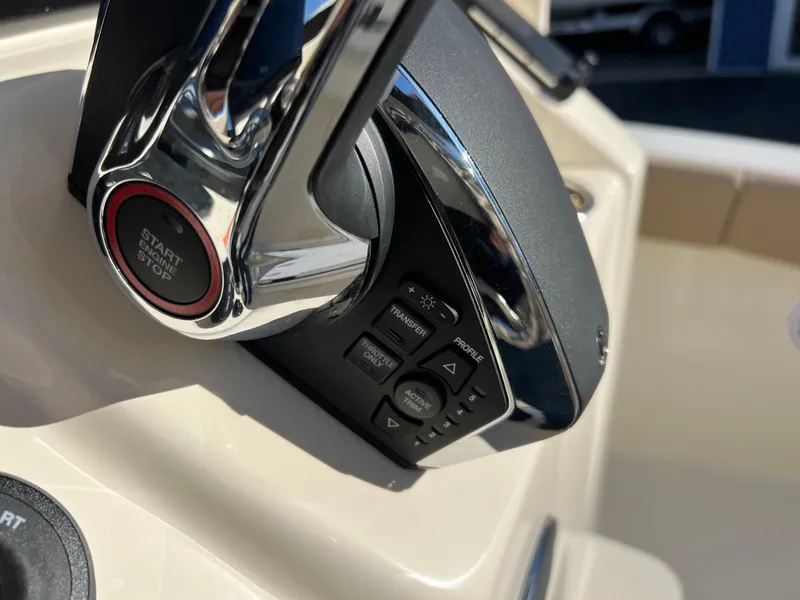 Slide: The Image of Close-up of 2024 Scout 215 XSF boat throttle controls. - 17