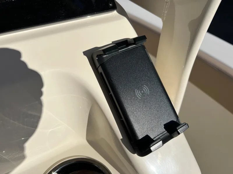 Slide: The Image of 2024 Scout 215 XSF boat wireless charging station close-up. - 19