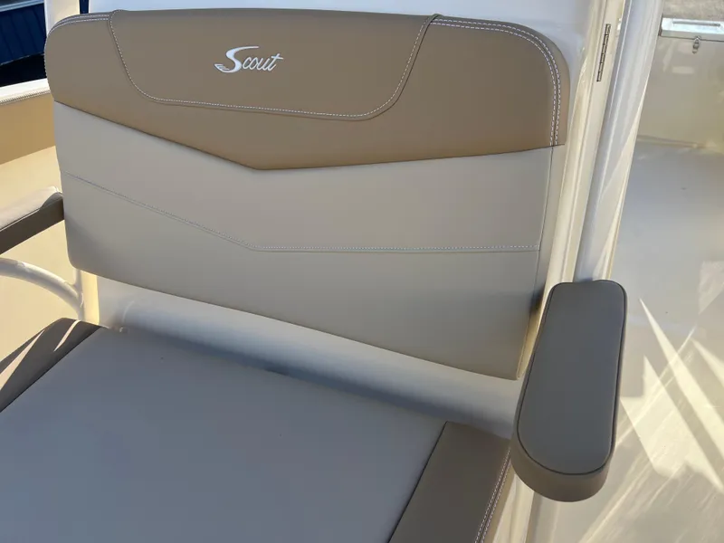Slide: The Image of 2024 Scout 215 XSF boat seat with beige and gray upholstery. - 27