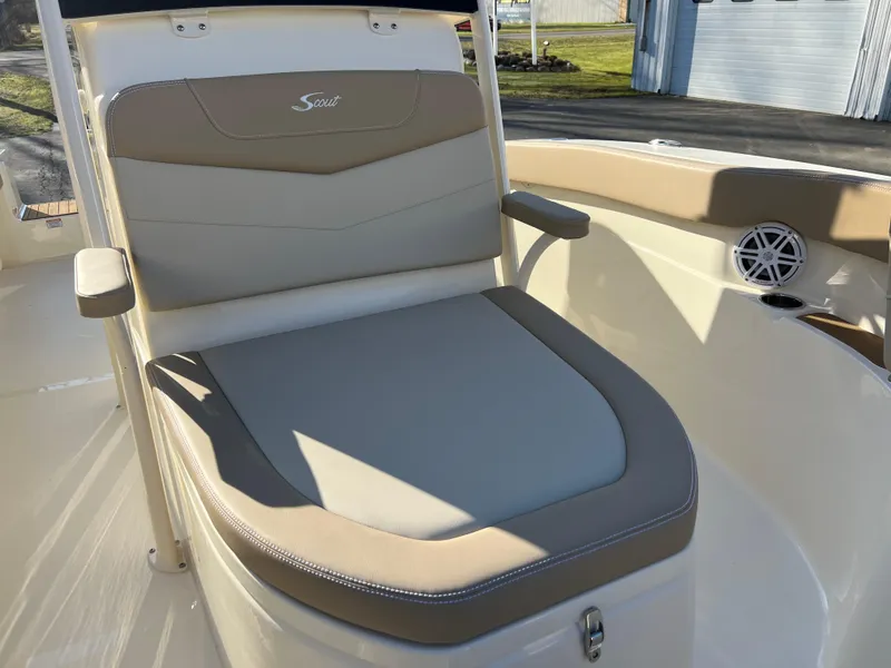 Slide: The Image of 2024 Scout 215 XSF boat seat with beige and gray upholstery. - 28