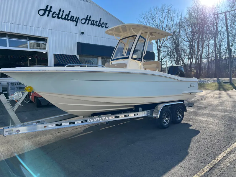 Slide: The Image of 2024 Scout 215 XSF boat on trailer at Holiday Harbor. - 3