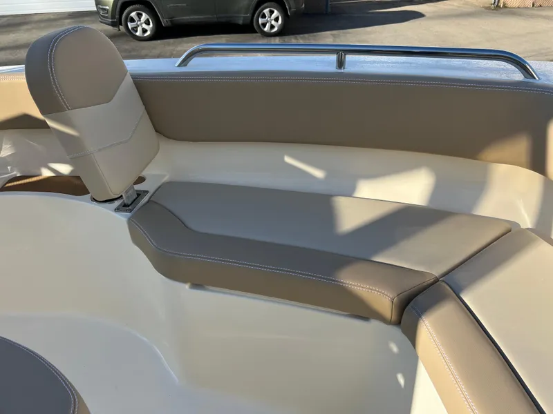 Slide: The Image of 2024 Scout 215 XSF boat interior with beige seating and sleek design. - 30