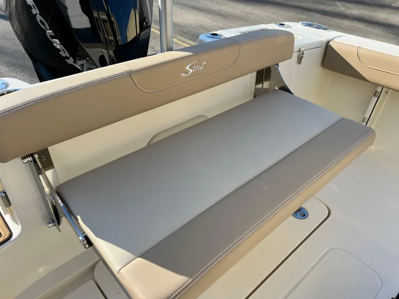 Slide: The Image of 2024 Scout 215 XSF boat with beige seating and Mercury engine. - 36