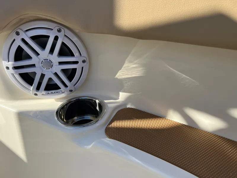 Slide: The Image of 2024 Scout 215 XSF boat interior with speaker and cup holder detail. - 38