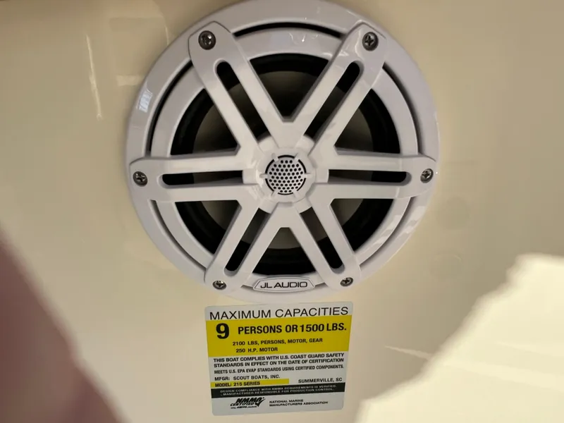 Slide: The Image of JL Audio speaker on 2024 Scout 215 XSF boat with capacity label. - 41