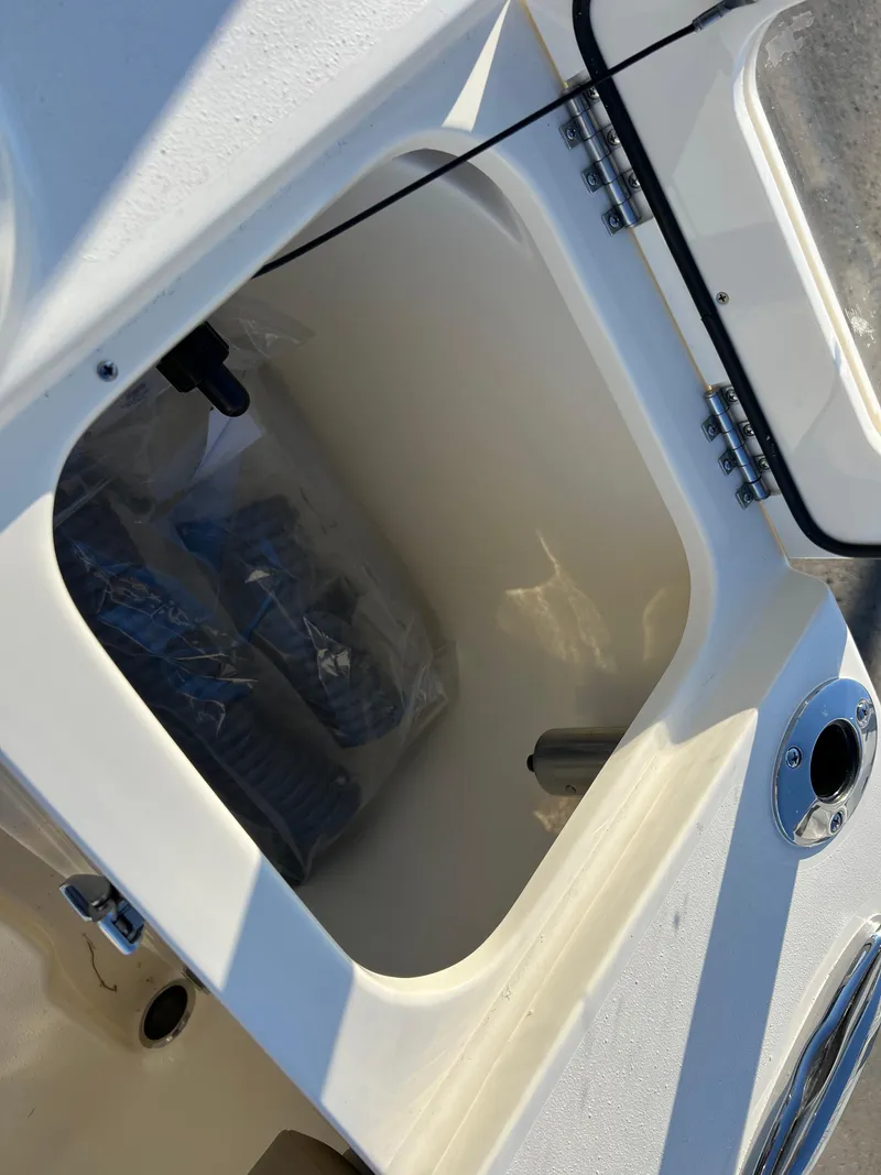 Slide: The Image of 2024 Scout 215 XSF storage compartment with open hatch. - 43