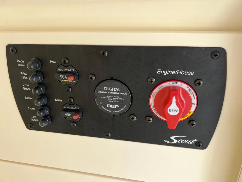 Slide: The Image of 2024 Scout 215 XSF boat control panel with digital voltage-sensitive relay. - 44