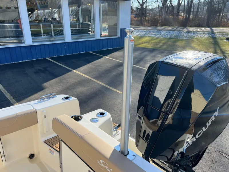 Slide: The Image of 2024 Scout 215 XSF boat with Mercury engine in parking lot. - 45