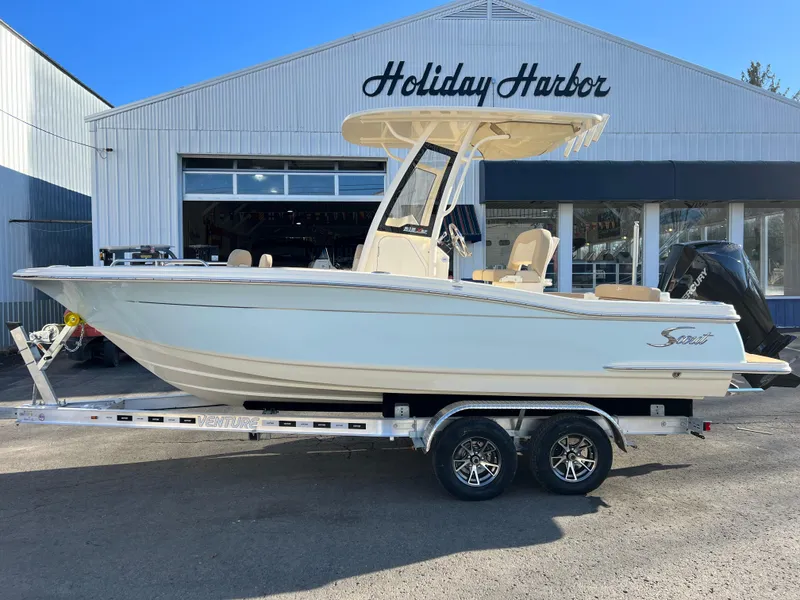 Slide: The Image of 2024 Scout 215 XSF boat on trailer at Holiday Harbor. - 7
