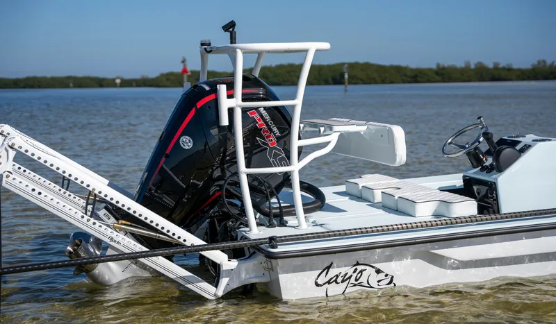 Slide: The Image of 2024 Cayo Boatworks 180 in shallow water with outboard motor. - 23