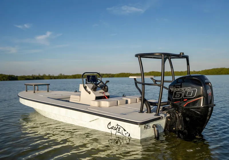 Slide: The Image of 2024 Cayo Boatworks 180 in water, rear view with Mercury 60 outboard motor. - 28
