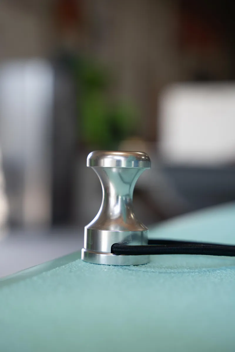 Slide: The Image of Close-up of a 2024 Cayo Boatworks 180 cleat with a rope. - 29